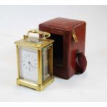 Howard James & Co early 20th century lacquered brass cased carriage clock having signed white enamel