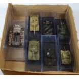 A collection of static models of tanks, in perspex cases