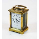 An early 20th century lacquered brass cased carriage clock by Mappin & Webb Ltd, height 12cm (handle