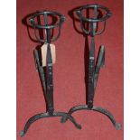 A pair of wrought iron andirons