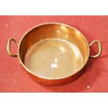 A large late 19th century copper preserve pan, having twin brass handles, w.50cm