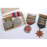 A 1939-45 War medal together with a Defence medal in box; and two Safe Driving medals with lapel
