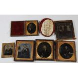 A collection of Victorian portrait ambrotypes, in leather cases