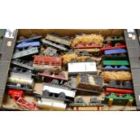 A box of assorted loose mainly 0 gauge rolling stock