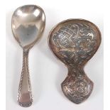 A Continental white metal and chased caddy spoon, stamped 90; together with a silver plated caddy