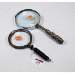 A magnifying glass, having Indian white metal handle, 22.5cm; together with one other plain