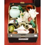 A box of miscellaneous items, to include conch shells, stoneware jugs etc