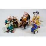 A set of five Royale Stratford porcelain anthropomorphic pigs, each in seated pose and in