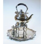 A silver plated tray having raised piecrust rim together with a spirit kettle on stand and a