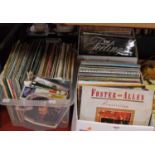 Three boxes of popular LPs; together with a small quantity of 7" singles