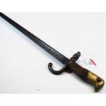 A French model 1874 Gras bayonet, having a 52cm cruciform blade with hooked quillon and two piece