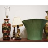 A 20th century oak barleytwist table lamp; together with another and a modern ceramic table lamp,