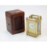 A circa 1900 French lacquered brass carriage clock having visible platform escapement, single barrel