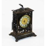 An early 20th century pierced brass cased mantel clock, by the British Union Clock Company, having