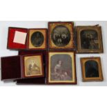 A collection of Victorian portrait ambrotypes, in leather cases