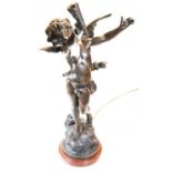 After Moreau - a spelter figural table lamp in the form of Cupid, with outstretched arms, on
