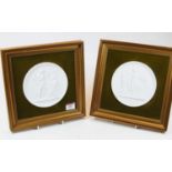 A pair of Royal Copenhagen blanc de chine porcelain relief moulded wall plaques dia 13.5cm, each