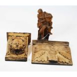 A 19th century carved oak bracket, decorated with a mask of a cherub , h.19cm; together with a