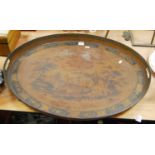A late 19th century copper Toleware style twin handled gallery tray, the centre decorated with