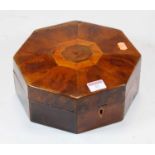 A 19th century inlaid yew wood octagonal box, the hinged lid lifting to reveal a brass liner, w.