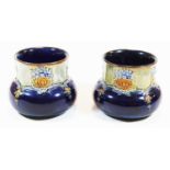 A pair of Royal Doulton stoneware squat vases each with impressed circle lion and crown mark