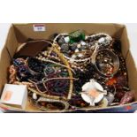 A box of miscellaneous costume jewellery to include faux pearl necklace, various bangles etc