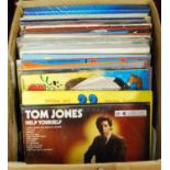 A box of assorted popular LPs, largely being compilations