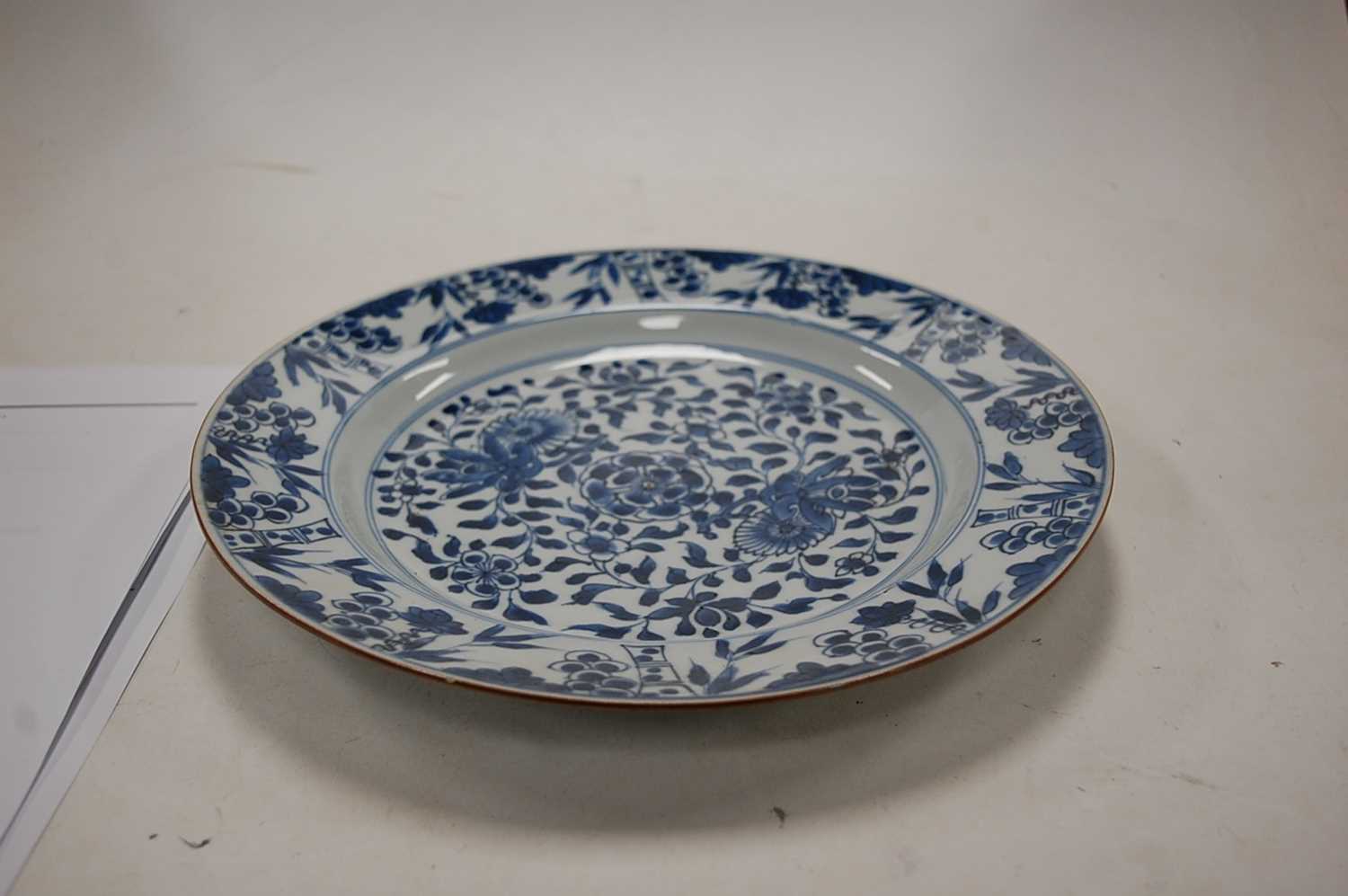 A 19th century Chinese blue and white export plate, decorated with flowers and bamboo, dia.28cm; - Image 3 of 9