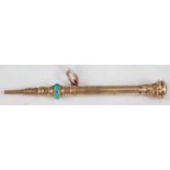 A Victorian engine turned yellow metal propelling pencil, having amethyst tip and turquoise set