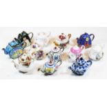 A collection of miniature teapots in china and enamelled metal to include Royal AlbertCondition