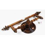 A 19th century turned walnut wall-mounted towel rail, w.61cm