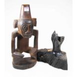 A 20th century carved hardwood figure of a stylised monkey, h.42cm, together with a hardwood