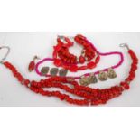 A faux red coral multi-string necklace; together with a similar three-string bracelet; a red dyed