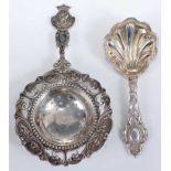 A mid-Victorian silver caddy spoon, having shell shaped bowl, London 1868, 10cm; together with a