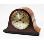 An early 20th century mahogany cased mantel clock, the silvered dial showing Arabic numerals, with