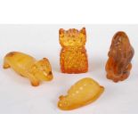 Four various small amber novelty animal carvings, to include owl, snail, and sausage-dog, owl h.3.