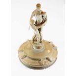 A mid 20th century painted plaster figure of a mother and children raised on socle base and