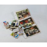 Assorted tea cards, other collectors cards to include Kellogg's, six postcards of Japanese