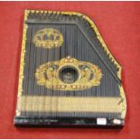 An early 20th century ebonised and gilt decorated zither