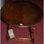 A Priory dark elm circular low occasional table, dia. 50cm