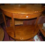 A pair of mahogany and satinwood strung demi-lune side tables, each on tapering supports to spade