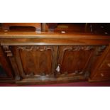 An early Victorian rosewood double door side cupboard, the blind frieze drawer over twin panelled