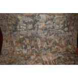 A Continental needlework embroidered tapestry wall hanging, depicting medieval battle scene within a