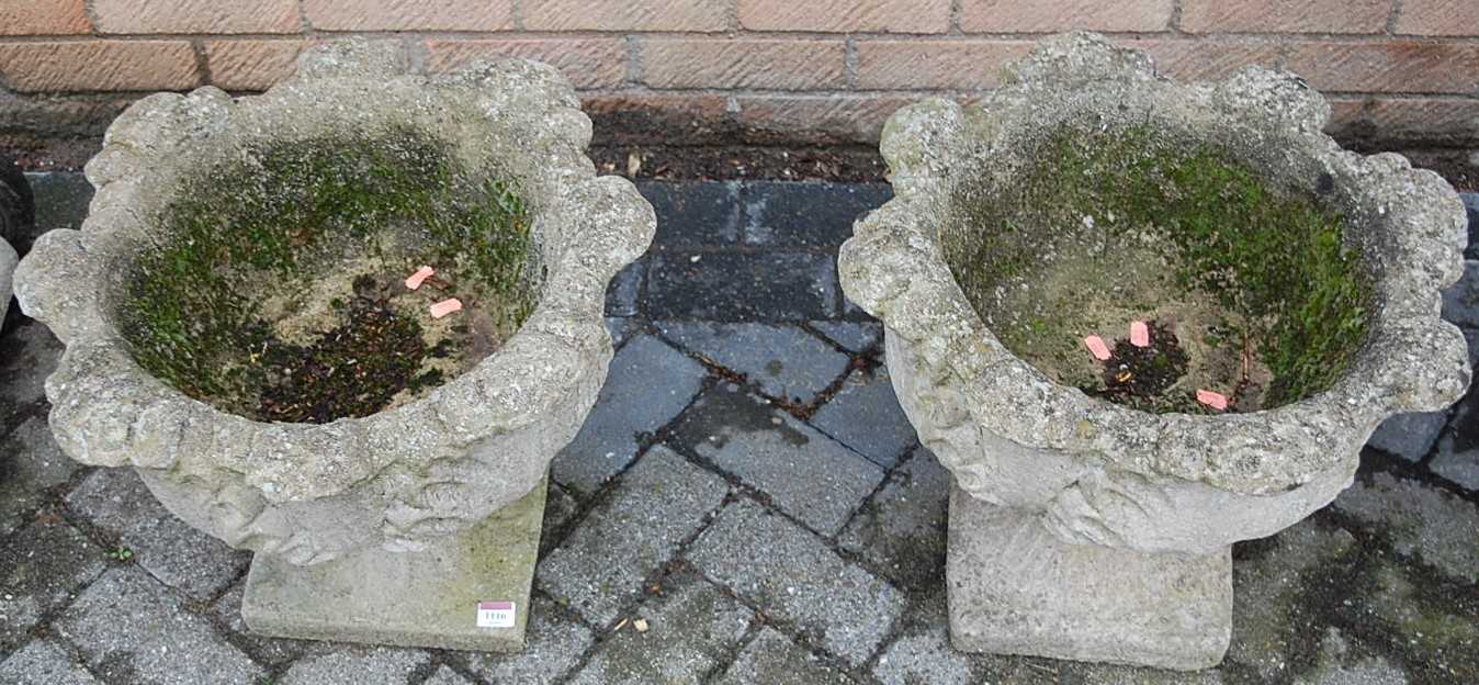 A pair of reconstituted stone pedestal garden planters, dia. 48cm