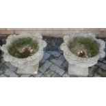 A pair of reconstituted stone pedestal garden planters, dia. 48cm