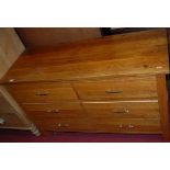A contemporary blond oak low chest, of six short drawers, w.114cm