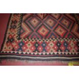 A large square red ground Kilim rug, 260 x 245cm