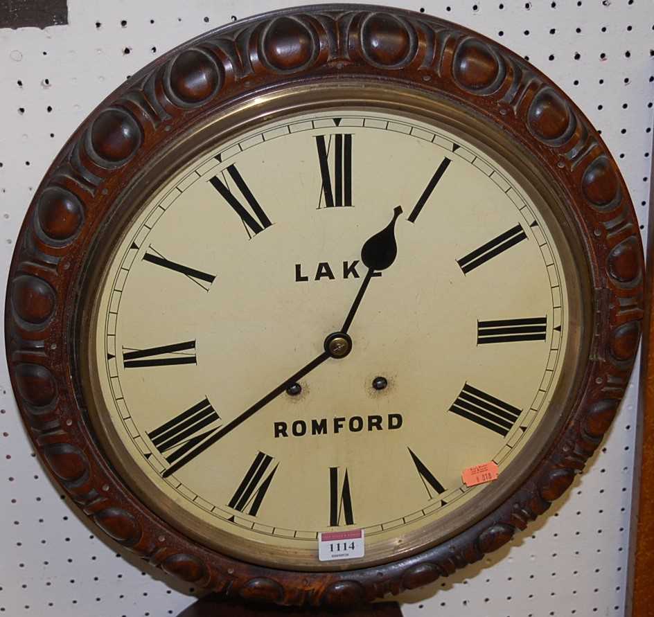 A Victorian rosewood(?) circular wall clock, the cream enamel dial with Roman numerals and signed