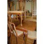 A 1930s walnut and figured walnut dining suite, comprising; extending dining table with pull-out