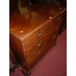 An early 19th century mahogany squarefront chest, of two short over three long graduated drawers,